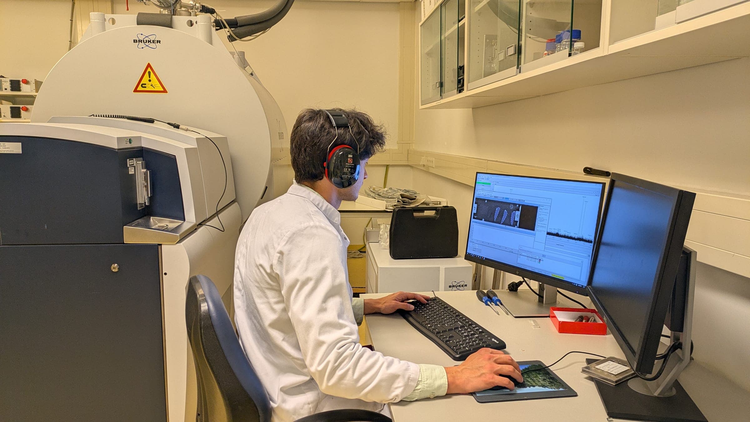 Molecular imaging results being reviewed on screen in the lab