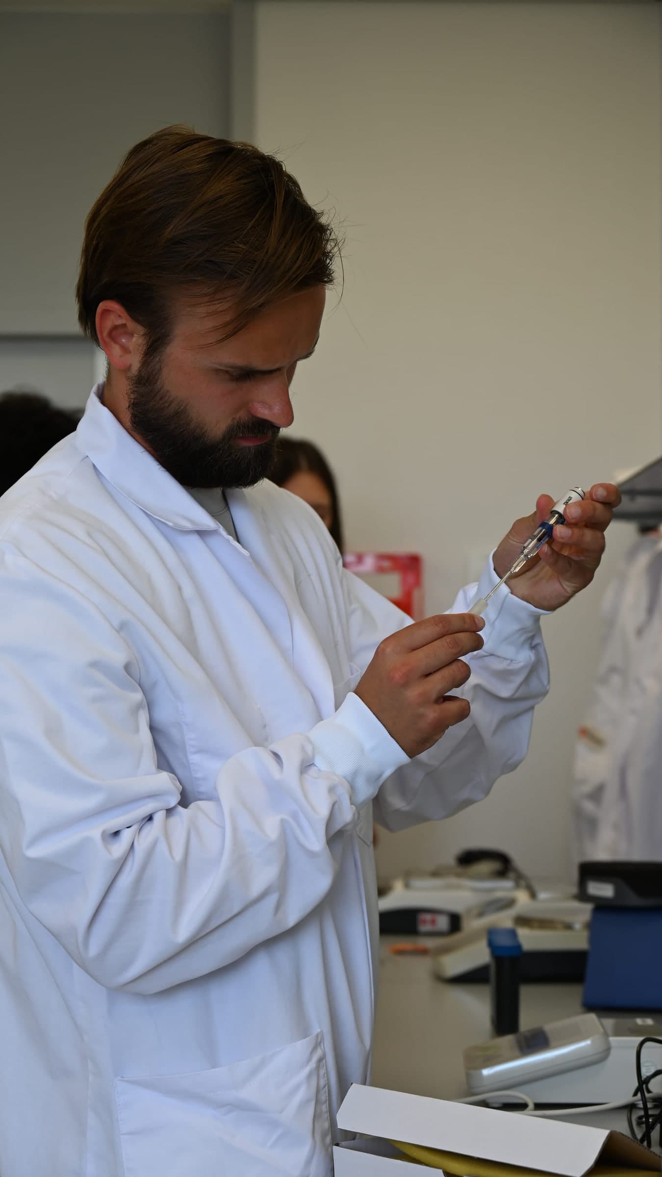 A researcher operating the automated processing workflow in the lab