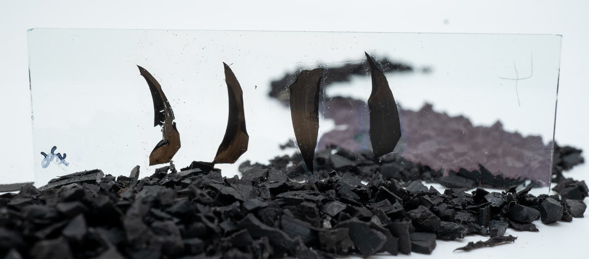 A thin rubber section being prepared at the lab bench